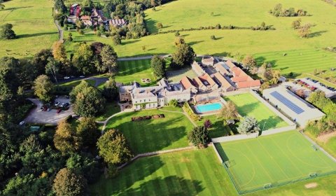 Aerial of school grounds green space playing fields